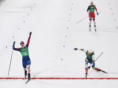 USA's Jessica Diggins (L) Sweden's Stina Nilsson  and Norway's Maiken Caspersen Falla cross the finish line to win gold, silver and bronze in the women's cross country team sprint free final at the Alpensia cross country ski centre during the Pyeongchang 2018 Winter Olympic Games on February 21, 2018 in Pyeongchang.