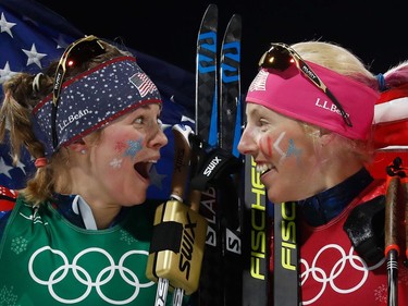 USA's Jessica Diggins (L) and USA's Kikkan Randall celebrate winning gold in the women's cross country team sprint free final at the Alpensia cross country ski centre during the Pyeongchang 2018 Winter Olympic Games on February 21, 2018 in Pyeongchang.