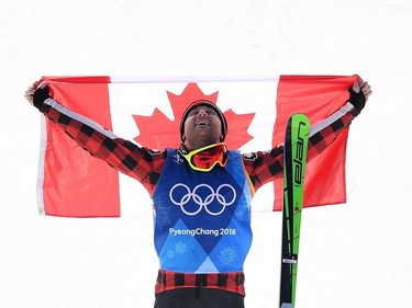 Gold medallist Canada's Brady Leman celebrates during the victory ceremony after the men's ski cross big final during the Pyeongchang 2018 Winter Olympic Games at the Phoenix Park in Pyeongchang on February 21, 2018.