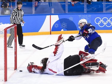 United States forward Jocelyne Lamoureux (17) scores the game winning shoot out goal past Canada goaltender Shannon Szabados (1) to win the gold medal during women's gold medal final olympic hockey action at the 2018 Olympic Winter Games in Gangneung, South Korea on Thursday, February 22, 2018.