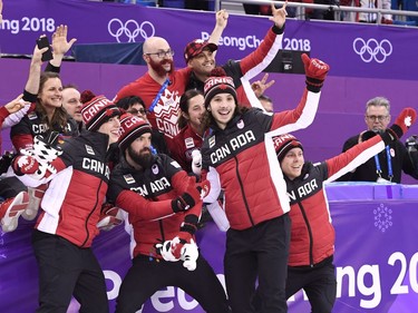 The Canadian team of Samuel Girard, Charles Hamelin, Charle Cournoyer and Pascal Dion celebrate as they capture bronze in the men's 5,000-metre relay final celebrates the 2018 Olympic Winter Games, in Gangneung, South Korea on Thursday, February 22, 2018.