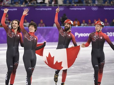 The Canadian team of Samuel Girard, left to right, Charle Cournoyer, Charles Hamelin and Pascal Dion celebrate as they capture bronze in the men's 5,000-metre relay final celebrates the 2018 Olympic Winter Games, in Gangneung, South Korea on Thursday, February 22, 2018.