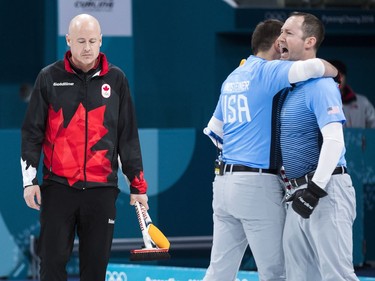 Canadian skip Kevin Koe, left, looks on while losing against the United States during the 2018 Olympic Winter Games in Gangneung, South Korea on Thursday, February 22, 2018. The United States won advancing to the gold medal match.