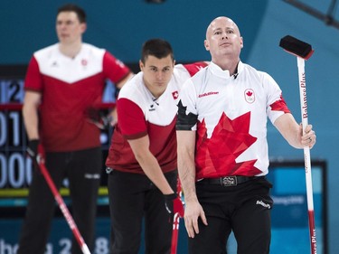 Kevin Koe, right, of Canada reacts during men's bronze medal curling finals against Switzerland at the 2018 Olympic Winter Games in Gangneung, South Korea on Friday, February 23, 2018. Switzerland defeated Canada to win the bronze medal.