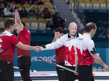 Skip Kevin Koe, second right, of Canada reacts, after losing to Switzerland during men's bronze medal curling finals at the 2018 Olympic Winter Games in Gangneung, South Korea on Friday, February 23, 2018.