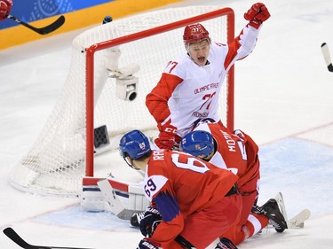Russia's Kirill Kaprizov (top) reacts in front of the Czech Republc goal in the men's semi-final ice hockey match between the Czech Republic and the Olympic Athletes from Russia during the Pyeongchang 2018 Winter Olympic Games at the Gangneung Hockey Centre in Gangneung on February 23, 2018.