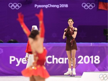 Gold medallist Russia's Alina Zagitova celebrates (L) as silver medallist Russia's Evgenia Medvedeva claps before the venue ceremony after the women's single skating free skating of the figure skating event during the Pyeongchang 2018 Winter Olympic Games at the Gangneung Ice Arena in Gangneung on February 23, 2018.