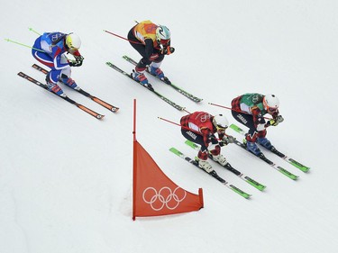 From left; Alizee Baron, of France, Sanna Luedi, of Switzerland, Kelsey Serwa, of Canada, and Brittany Phelan, of Canada, run the course during the women's ski cross semifinal at Phoenix Snow Park at the 2018 Winter Olympics in Pyeongchang, South Korea, Friday, Feb. 23, 2018.