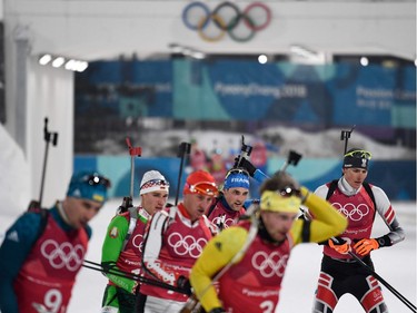 Sweden's Peppe Femling (front) arrives at the shooting range in the men's 4x7,5km biathlon event during the Pyeongchang 2018 Winter Olympic Games on February 23, 2018, in Pyeongchang.