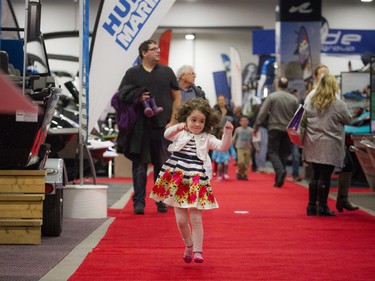 Three-year-old Hailey Nicholas kicked off her rubber boots and was skipping through the Ottawa Boat Show held at the EY Centre Sunday Feb. 25, 2018.   Ashley Fraser/Postmedia