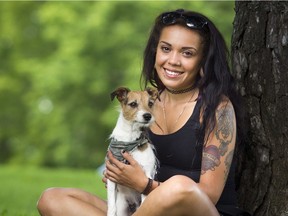 Selena Holder-Zirbser and her dog Rusty pose for a photo outside her home Sunday July 16, 2017. Holder had worked at the Rideau Street WeeMedical shop for about six weeks when it was raided. She pleaded guilty to drug trafficking and was given an absolute discharge.