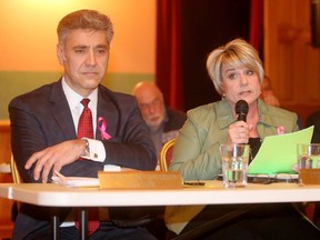 Carleton Place Mayor Louis Antonakos listens Tuesday night as Coun. Theresa Fritz, right, condemns the mayor's actions.