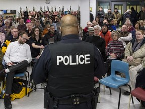 Ottawa police Const. Kevin Williams addresses crowd at a Neighbourhood Watch information session in Bells Corners. Williams is the community officer for the area of west end Ottawa that has been experiencing an increase in crime recently. Errol McGihon