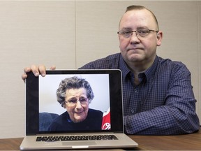 Bradley Sproule shows a photo of his grandmother, Doris Lawton.