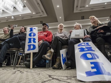 Spectators look on during a rally for Ontario PC leadership candidate, Doug Ford, at the Infinity Convention Centre in Ottawa Monday, February 19, 2018 (Photo/Darren Brown)