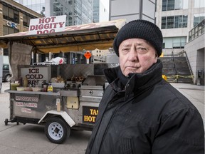 Terry Scanlon, pictured in this file photo from 2018 alongside his downtown hotdog cart,  suffered a heart attack on April 30 and is recuperating at the University of Ottawa Heart Institute.