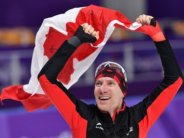 Canada's Ted-Jan Bloemen celebrates winning the gold medal in the men's 10,000m speed skating event during the Pyeongchang 2018 Winter Olympic Games at the Gangneung Oval in Gangneung on February 15, 2018.