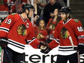 The contracts of Chicago Blackhawks' Jonathan Toews (left) and Patrick Kane have put the team in a bind. (AP PHOTO)