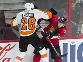 Senators defenceman Fredrik Claesson collides with Philadelphia Flyers' Claude Giroux during Saturday's game