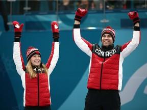 Gold medal winners Kaitlyn Lawes and John Morris of Canada celebrate during the victory ceremony after Curling Mixed Doubles Gold Medal Game on day four of the PyeongChang 2018 Winter Olympic Games at Gangneung Curling Centre on February 13, 2018 in Gangneung, South Korea.