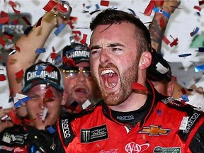 Austin Dillon celebrates in Victory Lane after winning the Monster Energy NASCAR Cup Series 60th Annual Daytona 500 on Sunday.