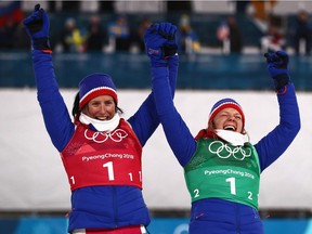 Marit Bjøergen, left, and Maiken Caspersen Falla of Norway celebrate as they receive their bronze medals for the team sprint on Wednesday.