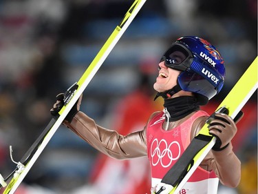 Poland's Kamil Stoch celebrates winning the men's large hill individual ski jumping event during the Pyeongchang 2018 Winter Olympic Games on February 17, 2018, in Pyeongchang.