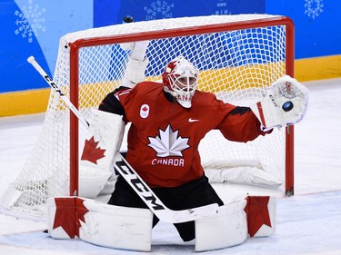 Canada's Kevin Poulin makes a save in the men's preliminary round ice hockey match between Canada and South Korea during the Pyeongchang 2018 Winter Olympic Games at the Gangneung Hockey Centre in Gangneung on February 18, 2018.