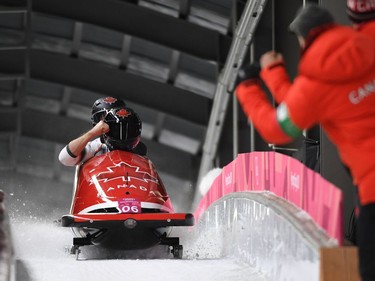 Canada's Alexander Kopacz and Justin Kripps slow down at the end of the 2-man bobsleigh heat 3 run during the Pyeongchang 2018 Winter Olympic Games, at the Olympic Sliding Centre on February 19, 2018 in Pyeongchang.