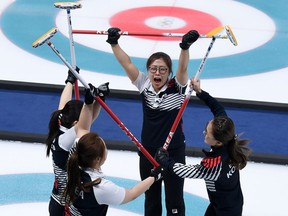 South Korea's players celebrate after winning the curling women's semifinal game against Japan on Friday. The South Koreans will face Sweden in the gold-medal final on Sunday.
