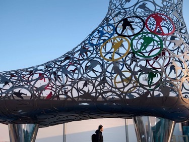 A man walks through the Gangneung Olympic Village in Gangneung on February 8, 2018, ahead of the Pyeongchang 2018 Winter Olympic Games.