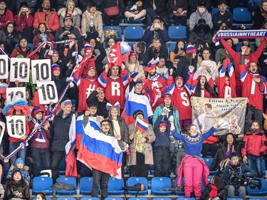 Spectators hold up placards in support of Russia's Mikhail Kolyada during the figure skating team event men's single skating short program during the Pyeongchang 2018 Winter Olympic Games at the Gangneung Ice Arena in Gangneung on February 9, 2018.