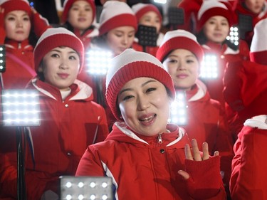 Members of the North Korean cheering band wave ahead of the opening ceremony of the Pyeongchang 2018 Winter Olympic Games at the Pyeongchang Stadium on February 9, 2018.
