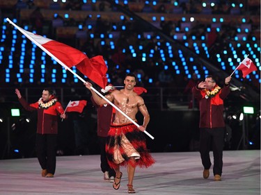 Tonga's flagbearer Pita Taufatofua leads his country's delegation during the opening ceremony of the Pyeongchang 2018 Winter Olympic Games at the Pyeongchang Stadium on February 9, 2018.