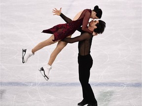 TOPSHOT - Canada's Tessa Virtue and Canada's Scott Moir compete in the figure skating team event ice dance free dance during the Pyeongchang 2018 Winter Olympic Games at the Gangneung Ice Arena in Gangneung on February 12, 2018.