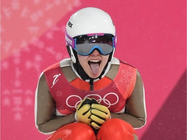 Russia's Irina Avvakumova reacts after her jump in the women's normal hill individual ski jumping trial for competition event during the Pyeongchang 2018 Winter Olympic Games on February 12, 2018, in Pyeongchang.