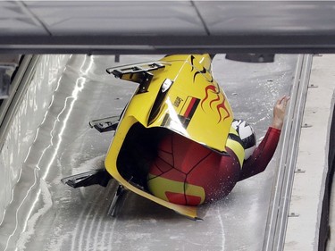 Driver Nico Walther and Christian Poser of Germany crash in the finish area after the second run during the two-man bobsled competition at the 2018 Winter Olympics in Pyeongchang, South Korea, Sunday, Feb. 18, 2018.