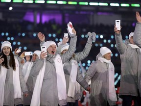 Russian athletes wave during the opening ceremony of the 2018 Winter Olympics.