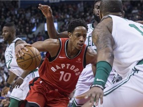 Toronto Raptors guard DeMar DeRozan (10) drives at the Boston Celtics Marcus Morris during second half NBA basketball action in Toronto on Tuesday February 6, 2018.