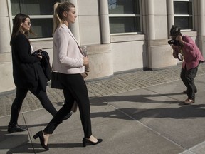 Canadian tennis star Eugenie Bouchard, second from left, is photographed as she leaves Brooklyn Federal court with her mother on Wednesday in New York.