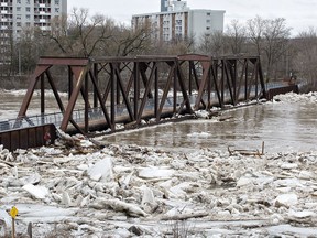 The Grand River in downtown Brantford, Ontario peaked in level just after noon hour Wednesday, as seen here at the pedestrian walkway on the former CNR bridge at Brant's Crossing. Rising water levels and ice moving on the river forced the City of Brantford to declare a state of emergency and order evacuation of residents in parts of the city on Wednesday February 21, 2018.