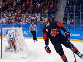 Maxim Noreau of Canada, reacts after failing to score in the penalty shootout against the Czech Republic.