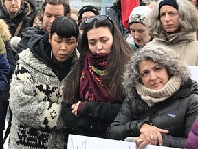 Charlotte Overvold, left in Cowichan sweater, is comforted after speaking at a rally on Parliament Hill for Colten Boushie. Blair Crawford/Postmedia