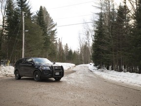 An Ontario Provincial Police cruiser blocks the scene of what police are investigating as a triple murder-suicide about 300 kilometres north of Toronto, in Ryerson Township, Ont., on Sunday, February 25, 2018. Police in a small central Ontario community say they're investigating the deaths of four people as a triple murder-suicide. Ontario Provincial Police say they believe a man killed two women and another man before killing himself in Ryerson Township, Ont., about 300 kilometres north of Toronto.