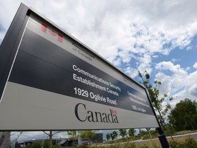 A sign for the Government of Canada's Communications Security Establishment (CSE) is seen outside their headquarters in the east end of Ottawa on July 23, 2015. A senior official from Canada's cyberspy agency says proposed new powers would allow it to stop a terrorist's mobile phone from detonating a car bomb, block the ability of extremists to communicate, or prevent a foreign power from interfering in Canada's democratic process.