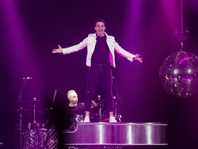 Jacob Hoggard, right, frontman for the rock group Hedley, performs during the band's concert in Halifax on Feb. 23.
