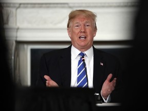 President Donald Trump speaks in the State Dining Room of the White House in Washington, Monday, Feb. 12, 2018, during a meeting with state and local officials about infrastructure.