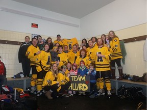 Photo from a hockey tournament the Allard family participated in March 2017. Shane Allard (top) holds a jersey with number nine on it. Ethan wore No. 9 because he was the 9th child in the family. Ethan's mother, Linda Allard, is near the centre with a 'C' on her Jersey.