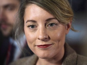 Minister of Canadian Heritage Melanie Joly speaks to reporters after leaving a cabinet meeting on Parliament Hill in Ottawa on February 6, 2018. The federal government doesn't believe it can do much on its own to stem the growing tide of fake news in Canada, according to a briefing package prepared for Canadian heritage minister Melanie Joly in November.
