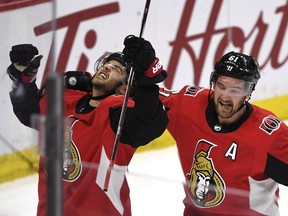 Ottawa Senators' Derick Brassard (19) celebrates his goal against the Buffalo Sabres to tie the game with Mark Stone (61) during third period NHL hockey action in Ottawa, Thursday February 15, 2018.